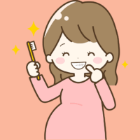 歯磨きをする妊娠中の女性